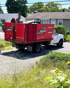 junk removal truck hauling away residential junk in huntington ny