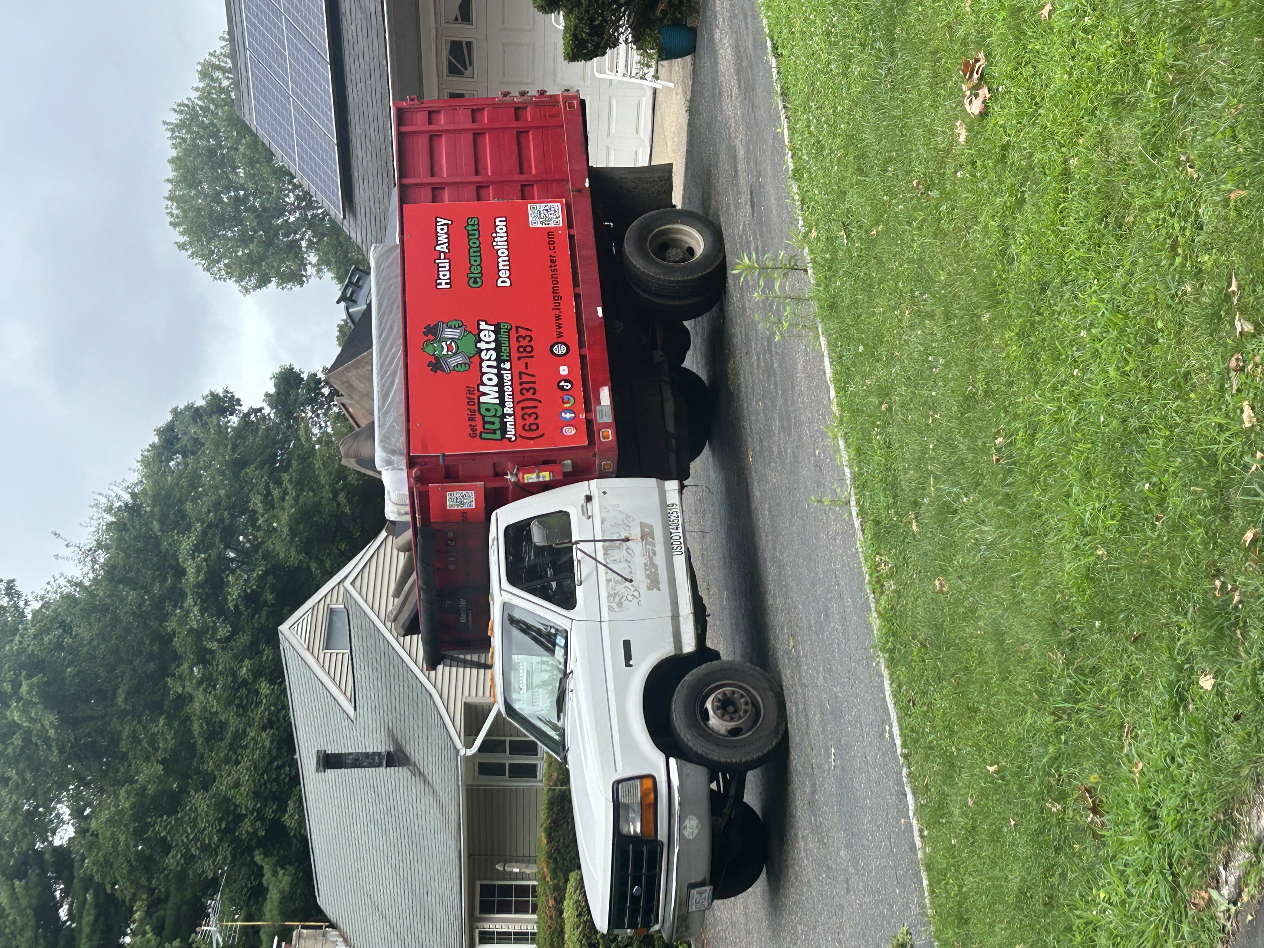 storage unit cleanout in Melville, New York a truck parked in a driveway