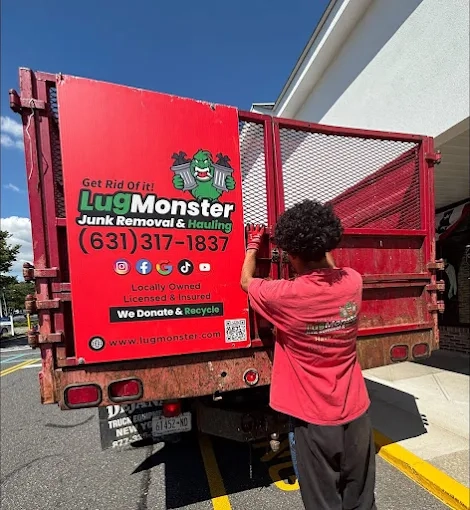Local junk removal service in Long Island NY with crew loading haul-away truck for cleanup